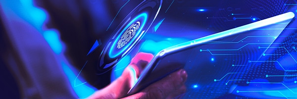 Person holding a tablet with digital interface elements and blue light effects, symbolizing AI technology and innovation in organizational processes.